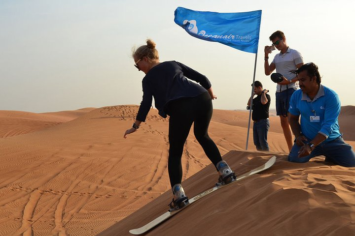 Feel the rush as you sandboard down the Dubai dunes surrounded by stunning desert landscapes and friendly guides creating unforgettable memories under the vast sky.